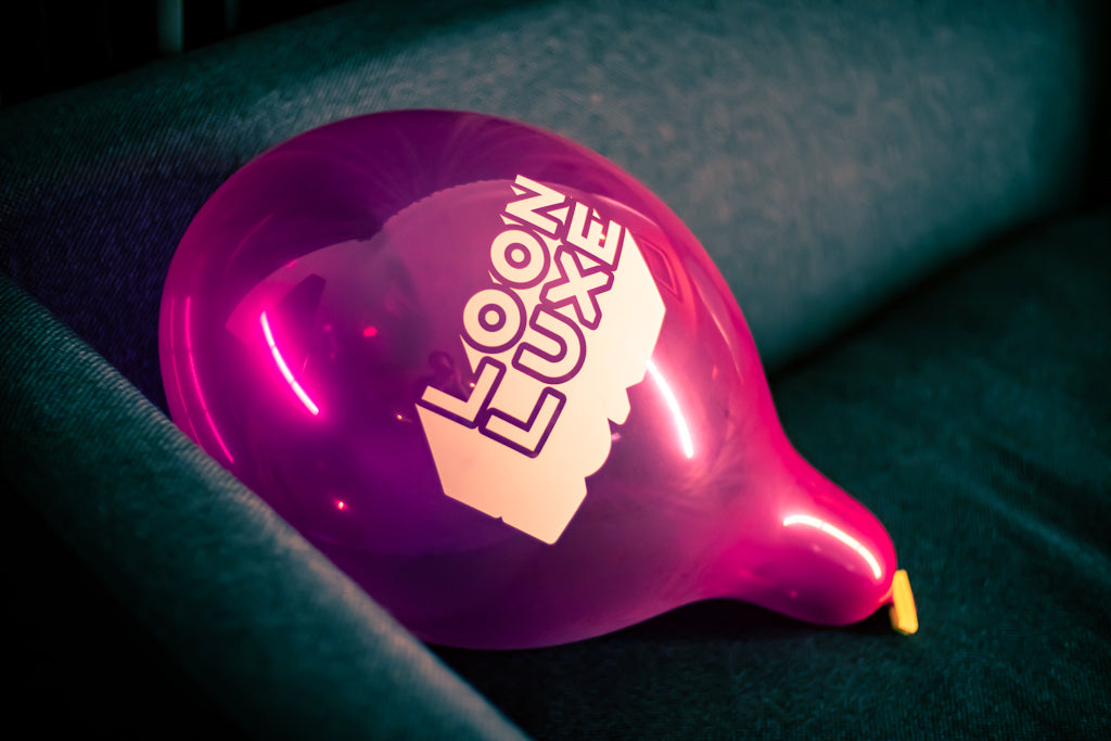 Pink custom printed 14inch Loon Luxe Balloon, fully inflated.