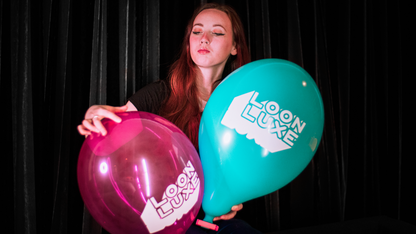 Model - holding custom printed Loon Luxe 14inch balloons.